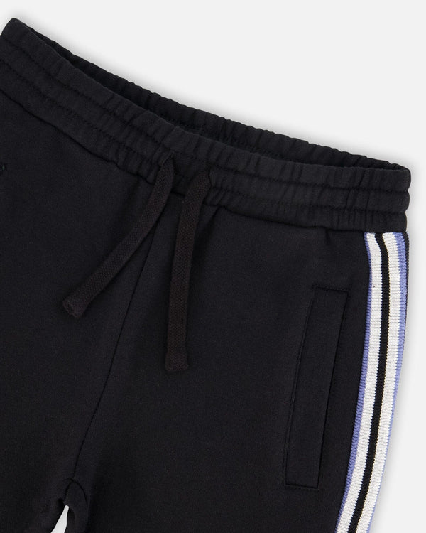Fleece Sweatpants With Side Stripes Black - H20U20_999